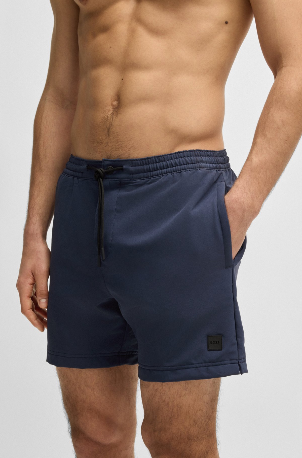 Bermudas de banho com logotipo e construção compactável