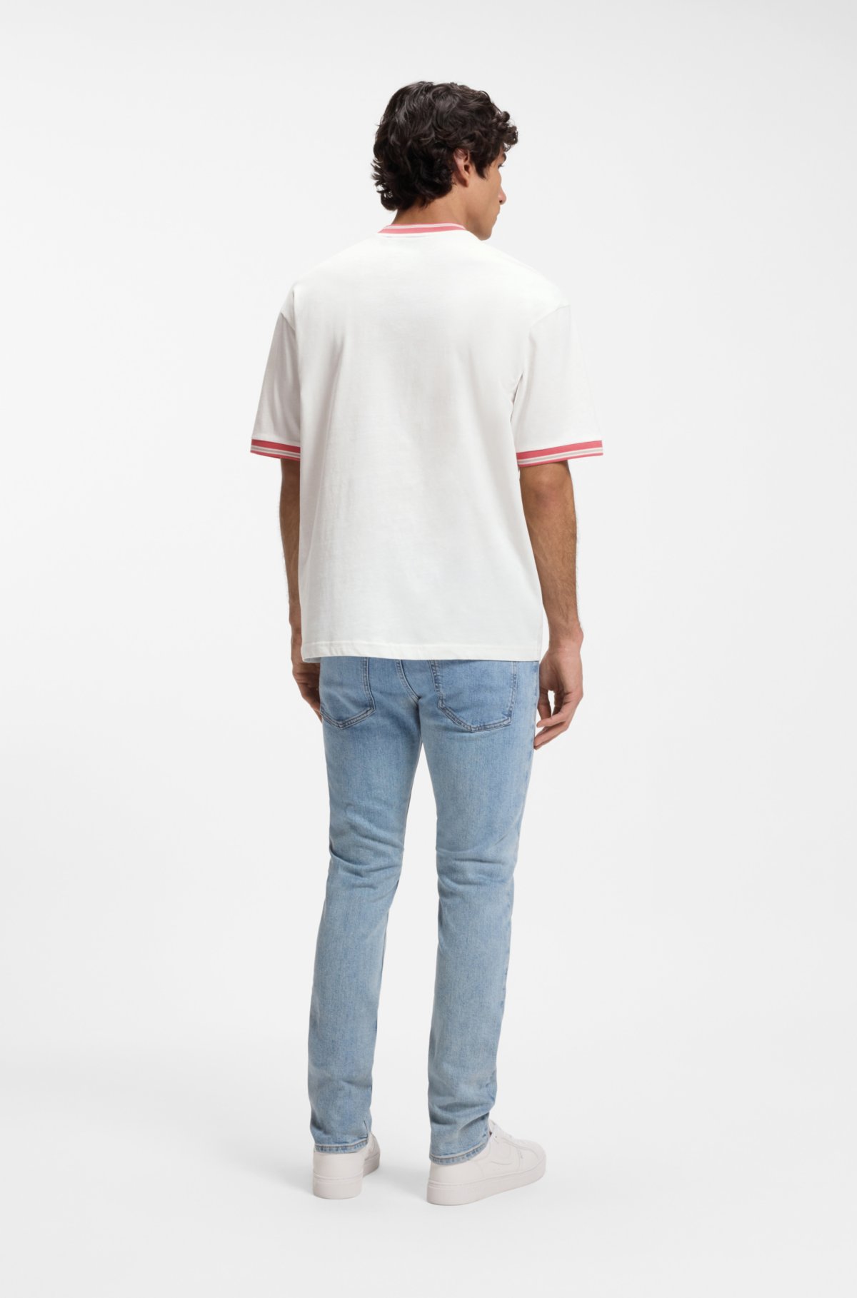 Camiseta solta em algodão com detalhes listrados