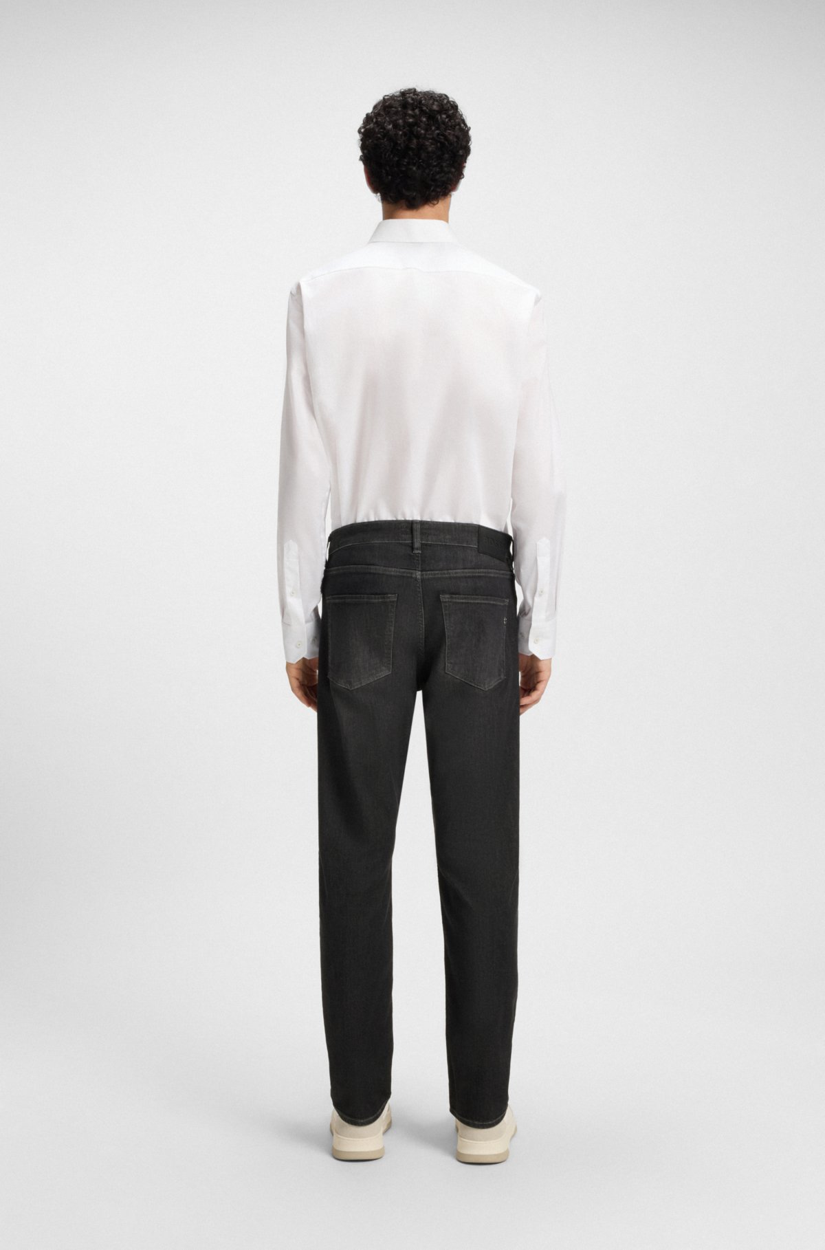 Calças jeans slim-fit pretas de Delaware em denim elástico
